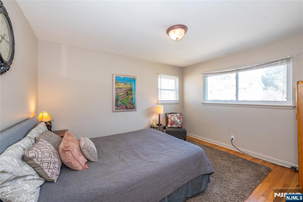 54 Harrison Street Dumont, NJ 07628 - Photo 19 of 35 a bedroom with a bed and window