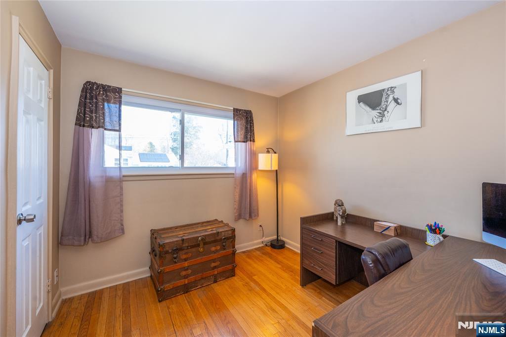 54 Harrison Street Dumont, NJ 07628 - Photo 20 of 35 a bedroom with furniture and a window