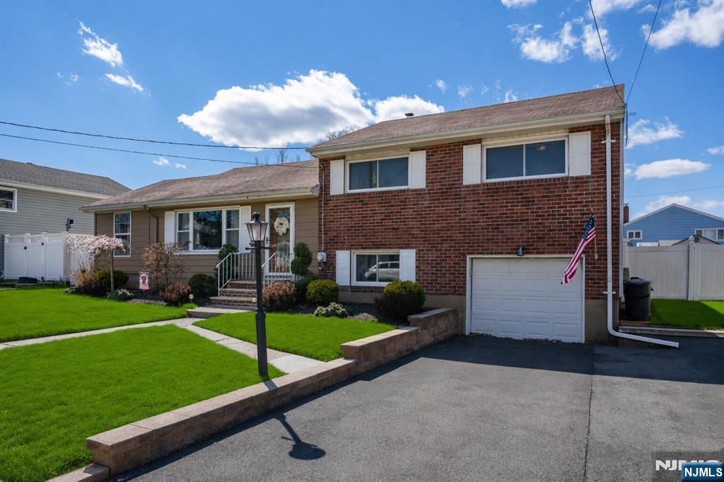 54 Harrison Street Dumont, NJ 07628 - Photo 2 of 35 a view of a house with a yard porch and sitting area