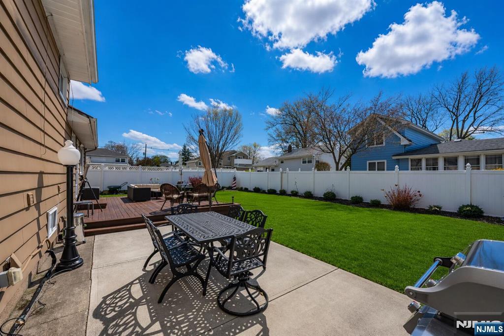 54 Harrison Street Dumont, NJ 07628 - Photo 27 of 35 a view of a backyard with sitting area