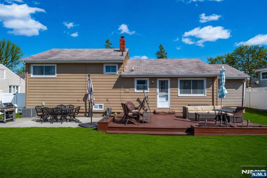 54 Harrison Street Dumont, NJ 07628 - Photo 28 of 35 a view of a house with backyard sitting area and garden