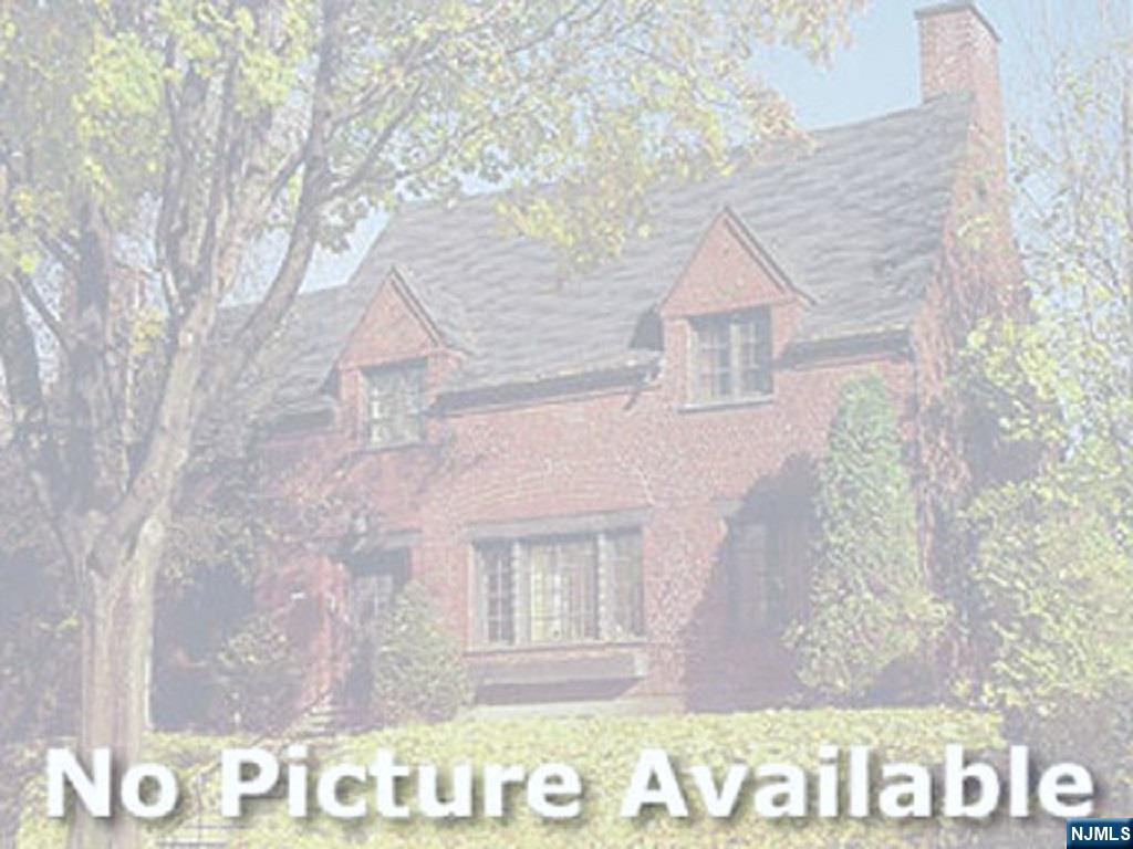 54 Harrison Street Dumont, NJ 07628 - Photo 30 of 35 a front view of a house with a yard