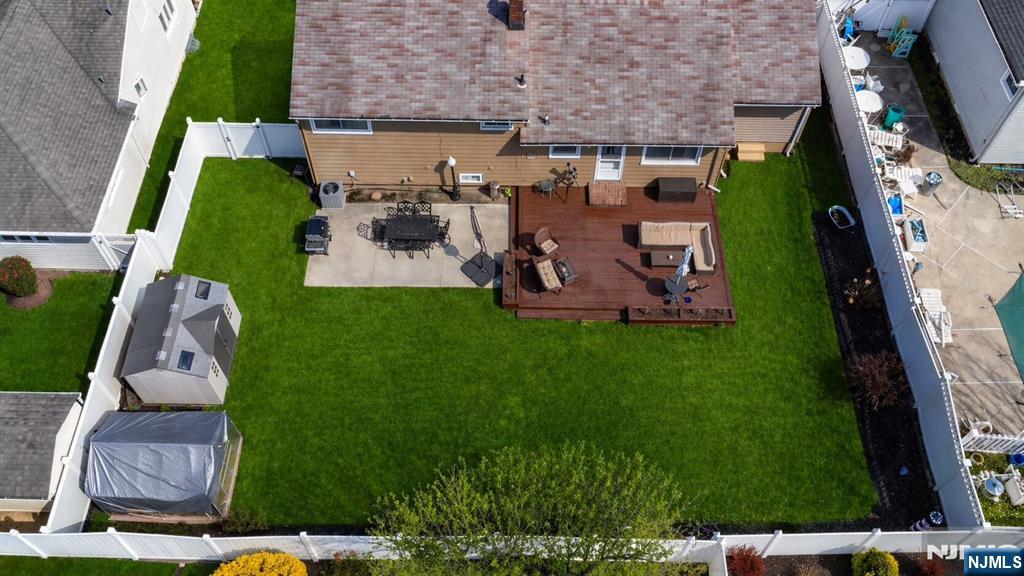 54 Harrison Street Dumont, NJ 07628 - Photo 31 of 35 an aerial view of multiple houses with outdoor space