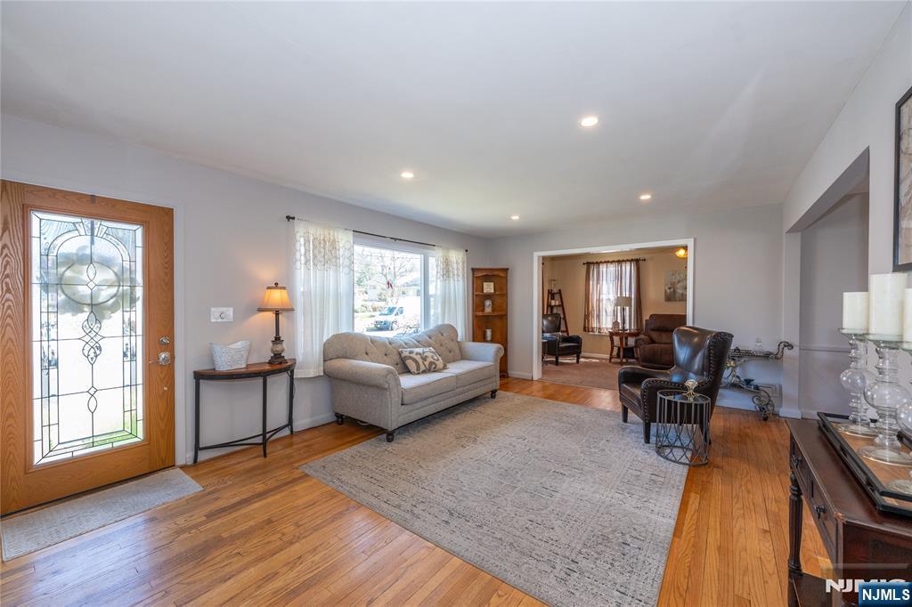 54 Harrison Street Dumont, NJ 07628 - Photo 5 of 35 a living room with furniture and wooden floor
