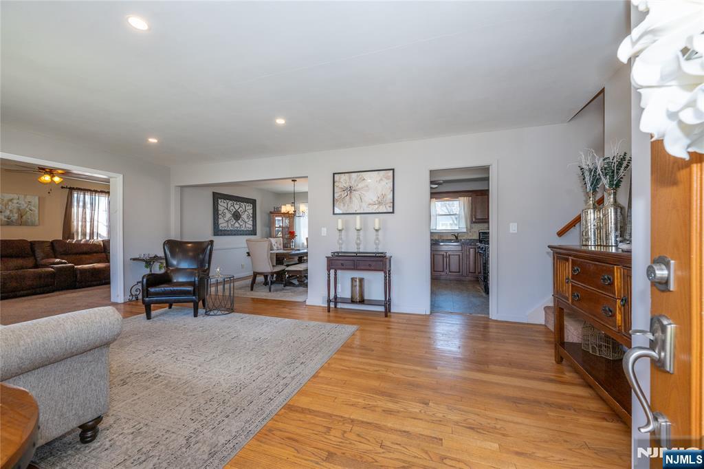 54 Harrison Street Dumont, NJ 07628 - Photo 6 of 35 a living room with furniture and a flat screen tv