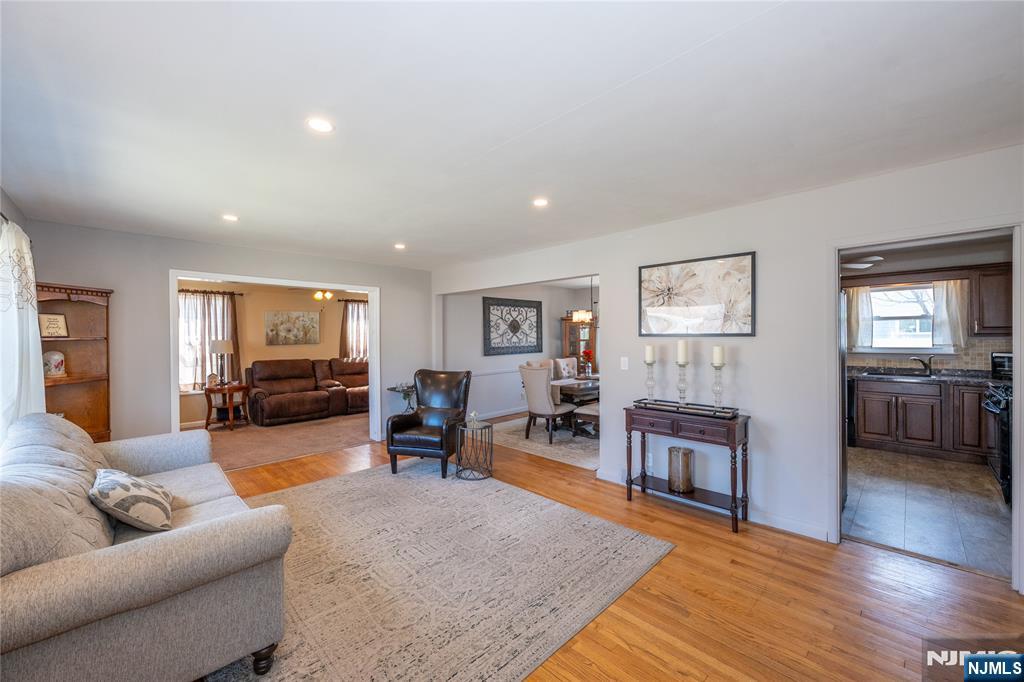 54 Harrison Street Dumont, NJ 07628 - Photo 7 of 35 a living room with furniture and wooden floor