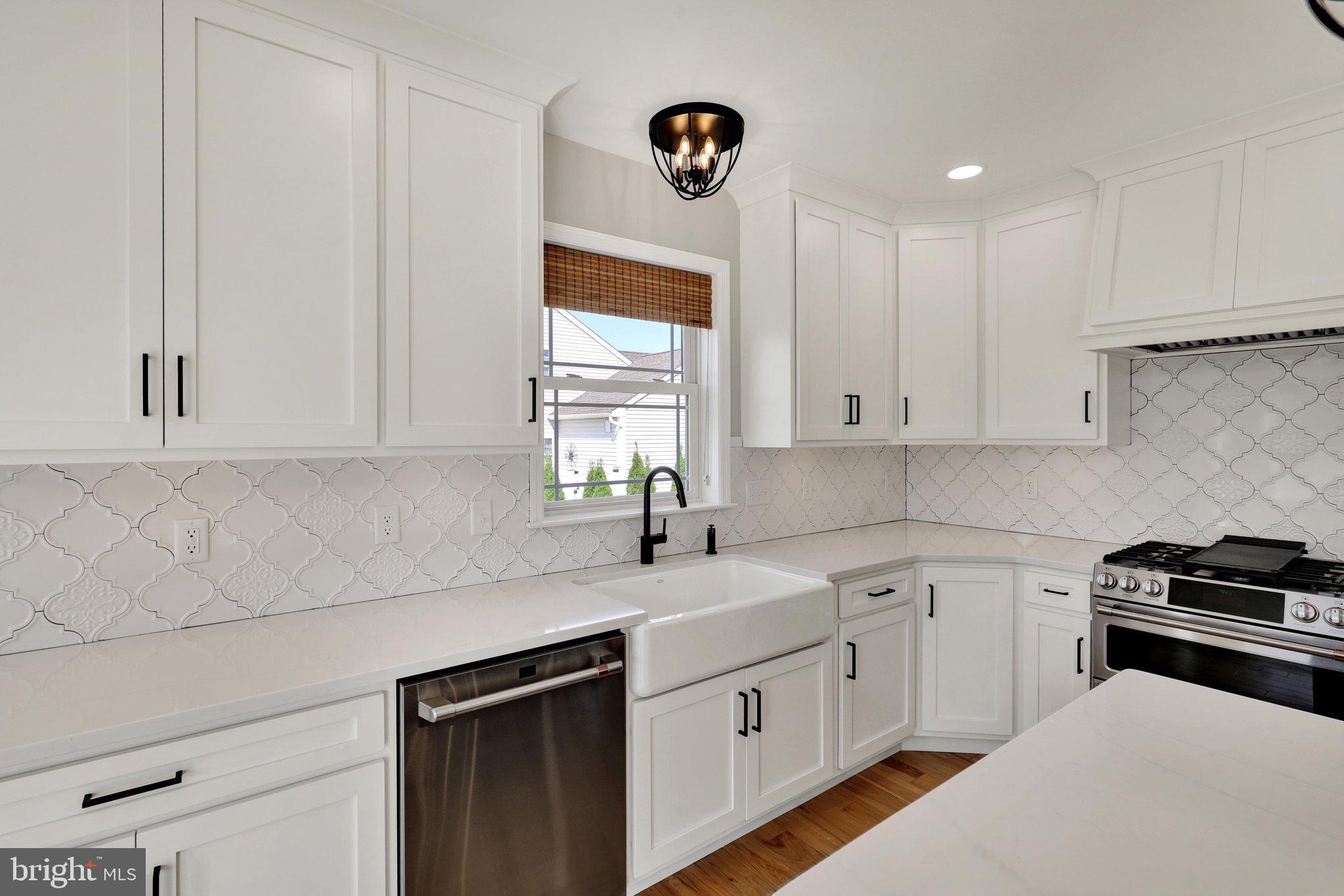 64 Middletown Road Fleetwood, PA 19522 - Photo 13 of 54 a kitchen with white cabinets appliances and a window