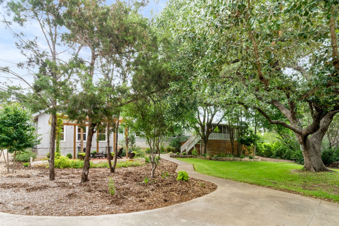 501 Box Canyon Road Wimberley, TX 78676 - Photo 1 of 1 a view of a yard with a house in the background
