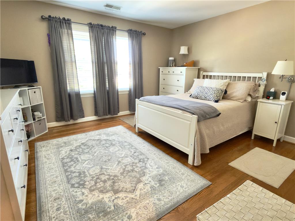 4982 Abbey Road Coplay, PA 18037 - Photo 30 of 55 Warm hardwood floors and large windows define this cozy bedroom retreat.
