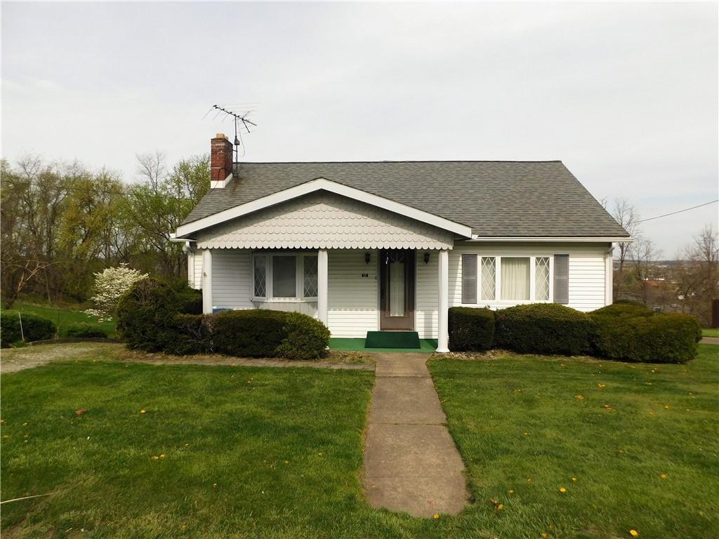 618 Morgantown Road Uniontown, PA 15401 - Photo 1 of 20 a front view of a house with a yard and garage