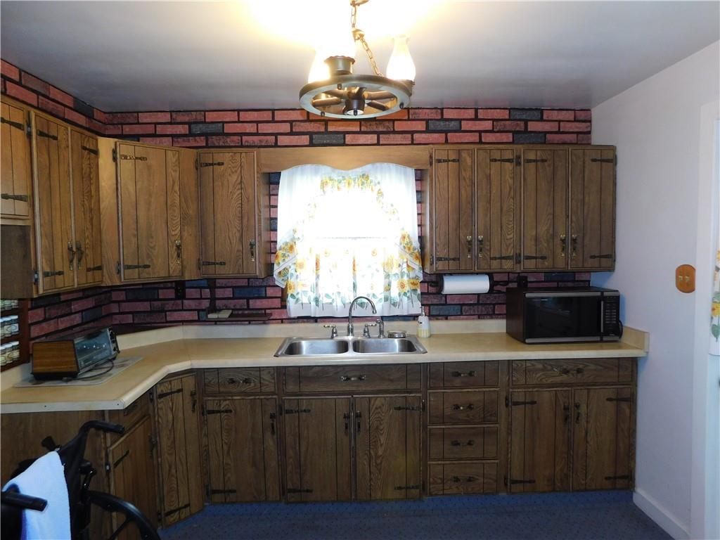 618 Morgantown Road Uniontown, PA 15401 - Photo 12 of 20 a kitchen with a sink and cabinets