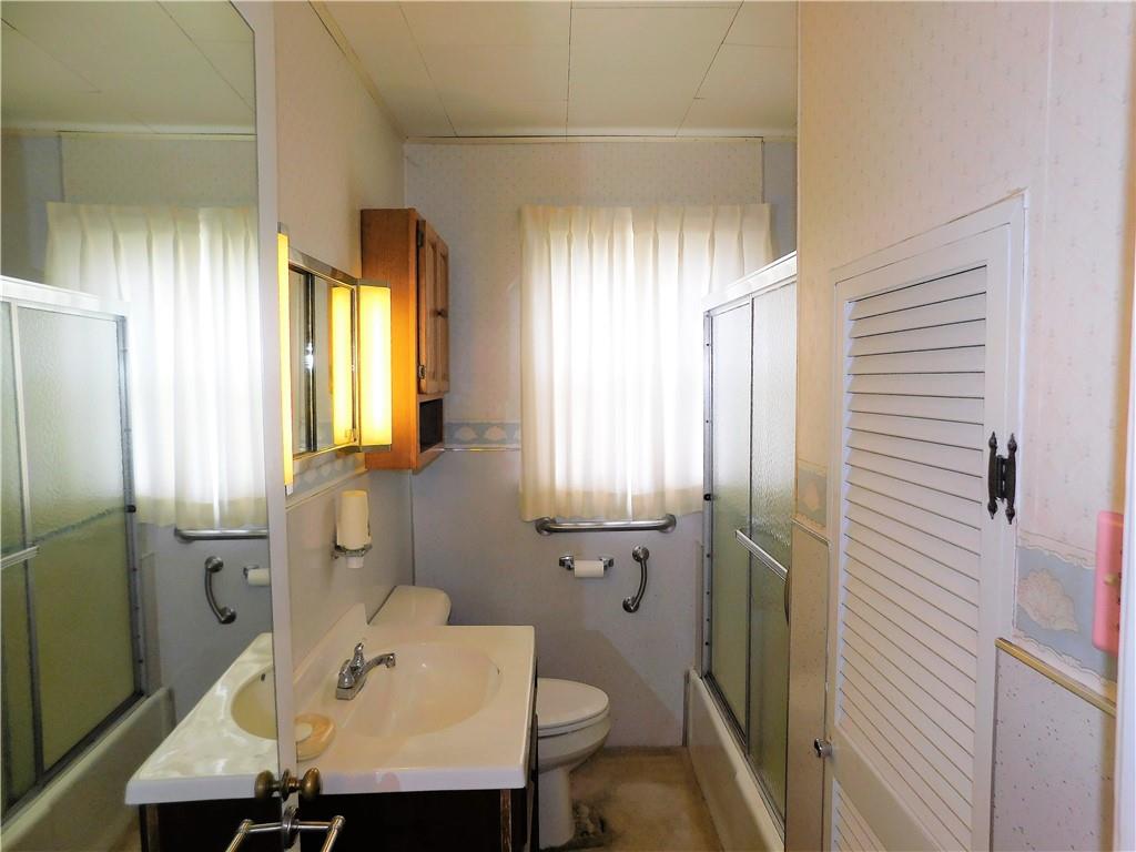 618 Morgantown Road Uniontown, PA 15401 - Photo 13 of 20 a bathroom with a sink and a mirror