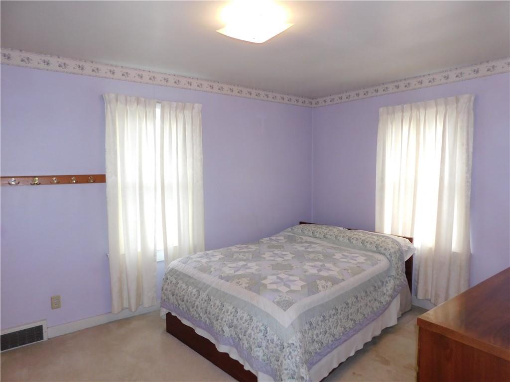 618 Morgantown Road Uniontown, PA 15401 - Photo 14 of 20 a bedroom with a bed a window and potted plant