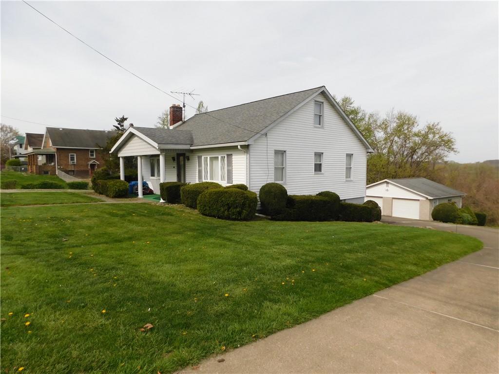 618 Morgantown Road Uniontown, PA 15401 - Photo 3 of 20 a front view of a house with yard and green space