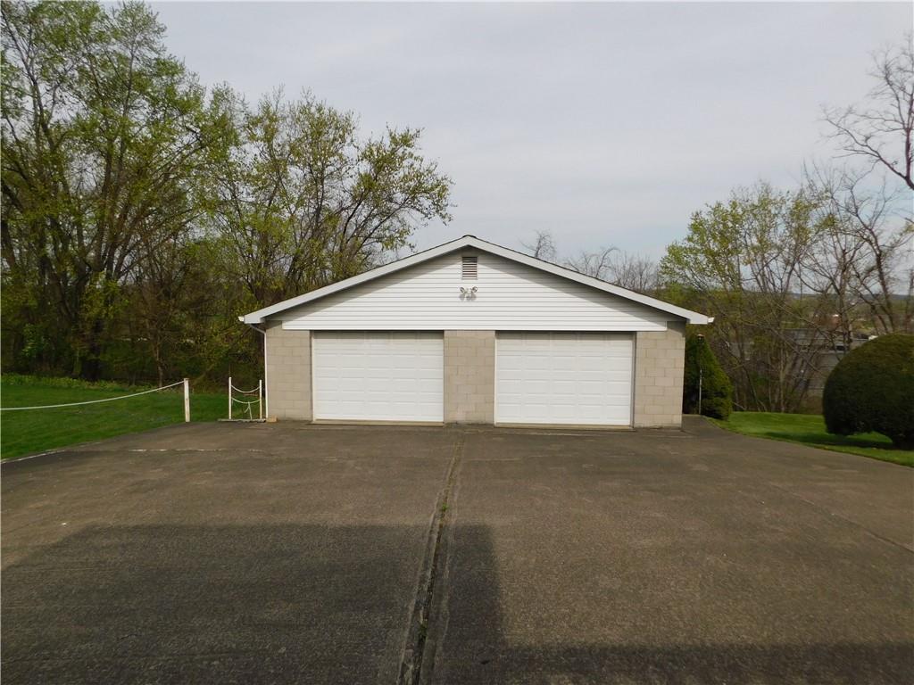 618 Morgantown Road Uniontown, PA 15401 - Photo 6 of 20 a view of a house with a yard and garage