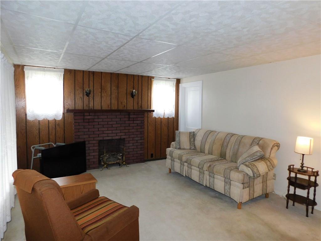618 Morgantown Road Uniontown, PA 15401 - Photo 7 of 20 a living room with furniture and a fireplace