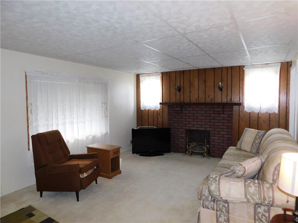 618 Morgantown Road Uniontown, PA 15401 - Photo 8 of 20 a living room with furniture and a fireplace