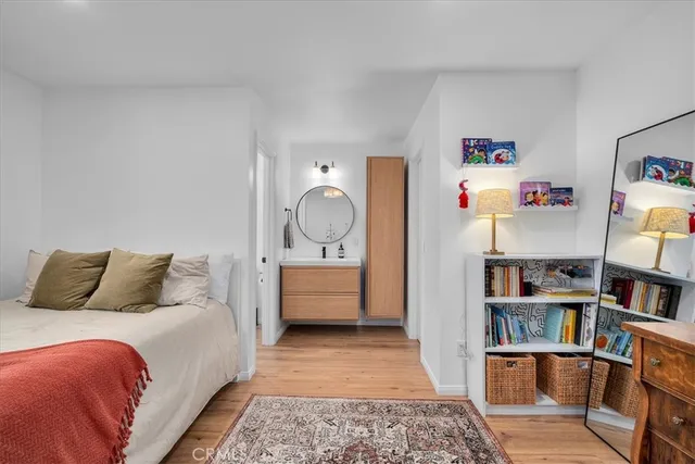 a bed room with a bed and a book shelf