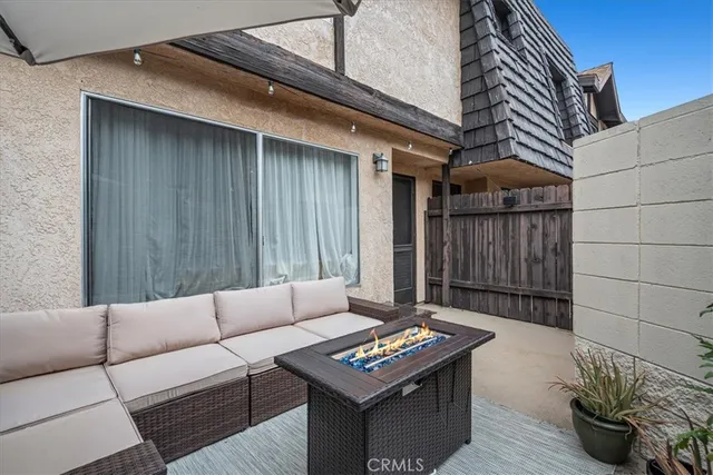 a outdoor living space with furniture and a potted plant