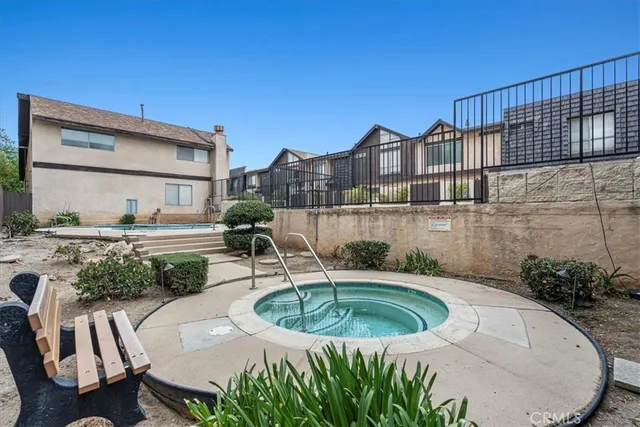 a view of a swimming pool with a patio