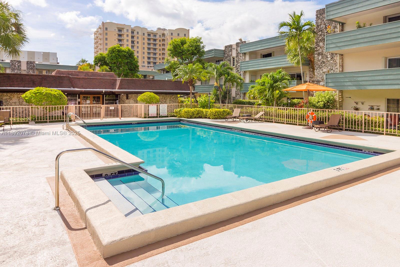 8305 Southwest 72nd Avenue, Unit 102A Miami, FL 33143 - Photo 7 of 18 a view of swimming pool with chairs