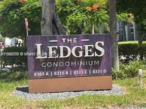 8305 Southwest 72nd Avenue, Unit 102A Miami, FL 33143 - Photo 9 of 18 a sign that is sitting on a wooden wall