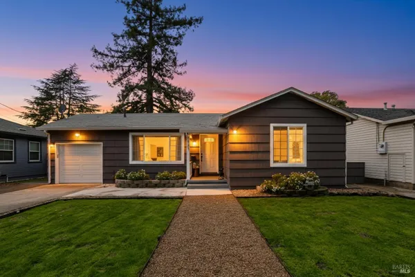 a front view of a house with a yard