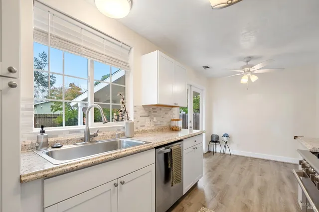 a kitchen with a sink and a window