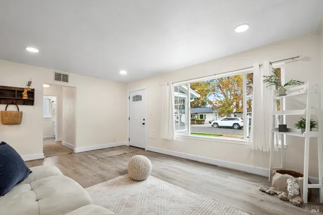 a living room with furniture and a window