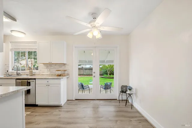 a view of a kitchen with a sink and a window