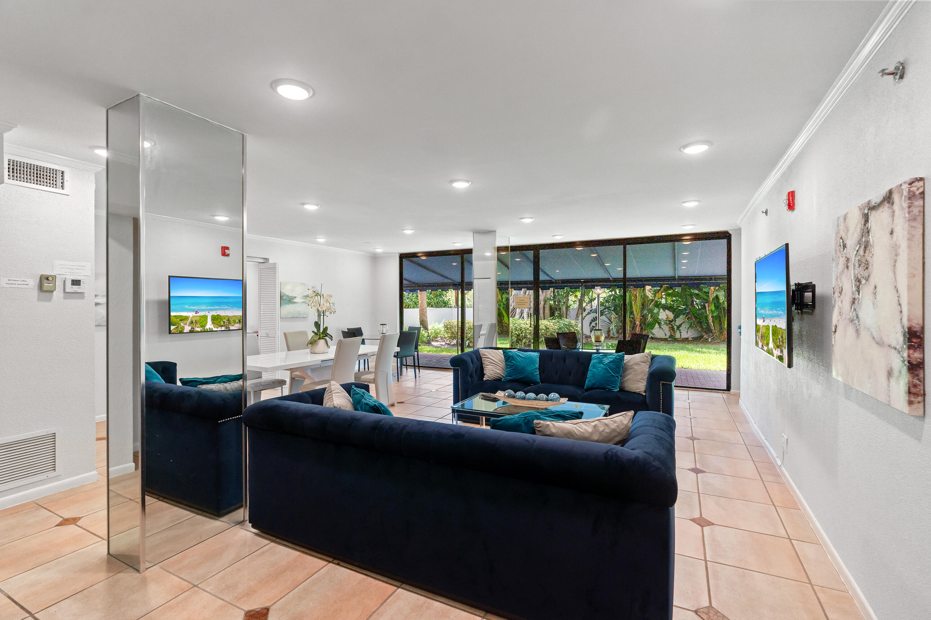 23200 Camino Del Mar, Unit 603 Boca Raton, FL 33433 - Photo 39 of 43 a living room with furniture and a large window