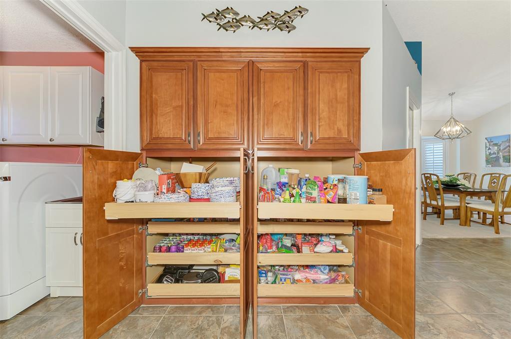 5868 Jefferson Road Venice, FL 34293 - Photo 28 of 68 Well designed Built-in Pantry with pull out drawers.