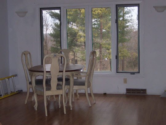5770 Fitzgerald Road Rockford, IL 61102 - Photo 2 of 3 a dining room with furniture and wooden floor