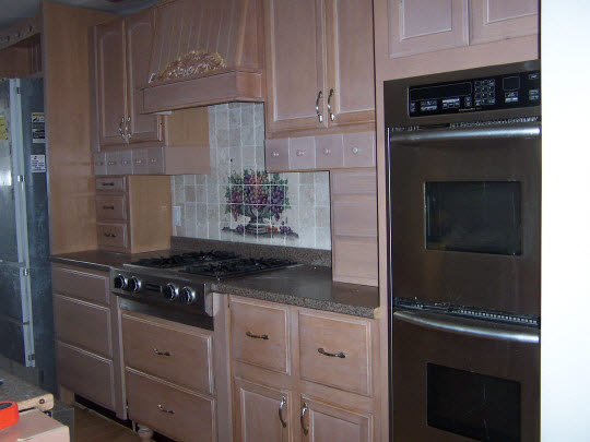 5770 Fitzgerald Road Rockford, IL 61102 - Photo 3 of 3 a kitchen with granite countertop cabinets stainless steel appliances and a counter space