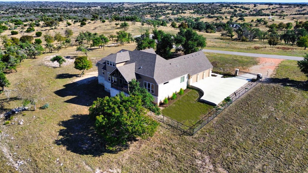 517 Dancing Sun Road Fredericksburg, TX 78624 - Photo 6 of 37 an aerial view of a house with a yard and lake view