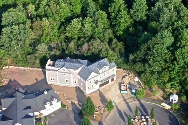 an aerial view of a house with outdoor space