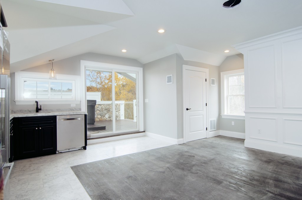 50 Beatrice Way Canton, MA 02021 - Photo 14 of 30 a view of a kitchen with a sink and dishwasher cabinets