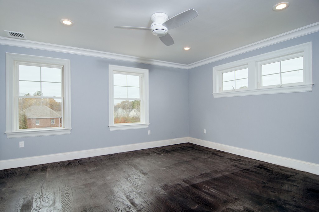 50 Beatrice Way Canton, MA 02021 - Photo 23 of 30 an empty room with wooden floor and windows