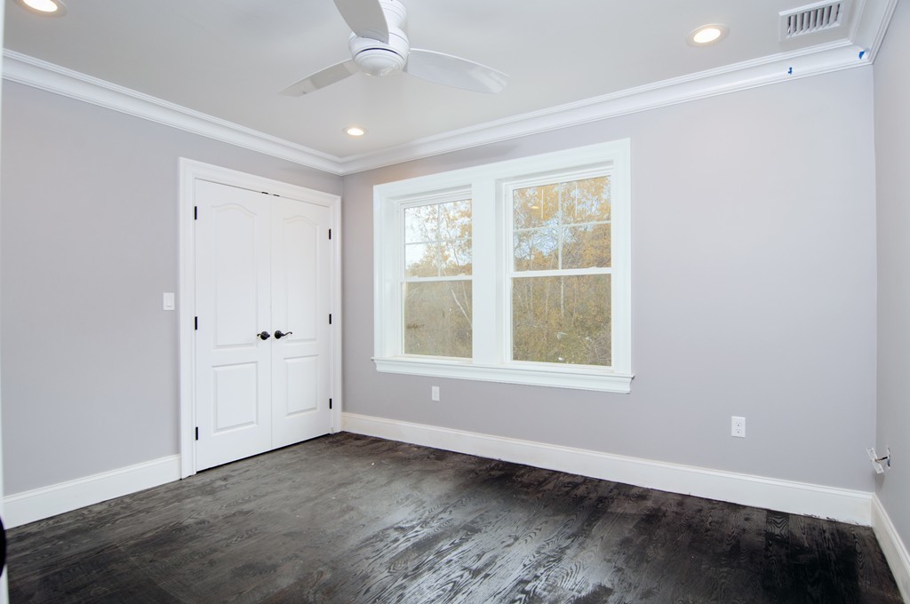 50 Beatrice Way Canton, MA 02021 - Photo 25 of 30 an empty room with wooden floor and windows