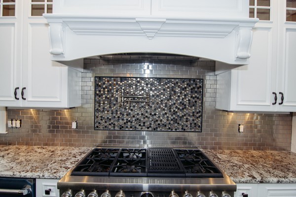 50 Beatrice Way Canton, MA 02021 - Photo 6 of 30 a kitchen with a stove a microwave and cabinets