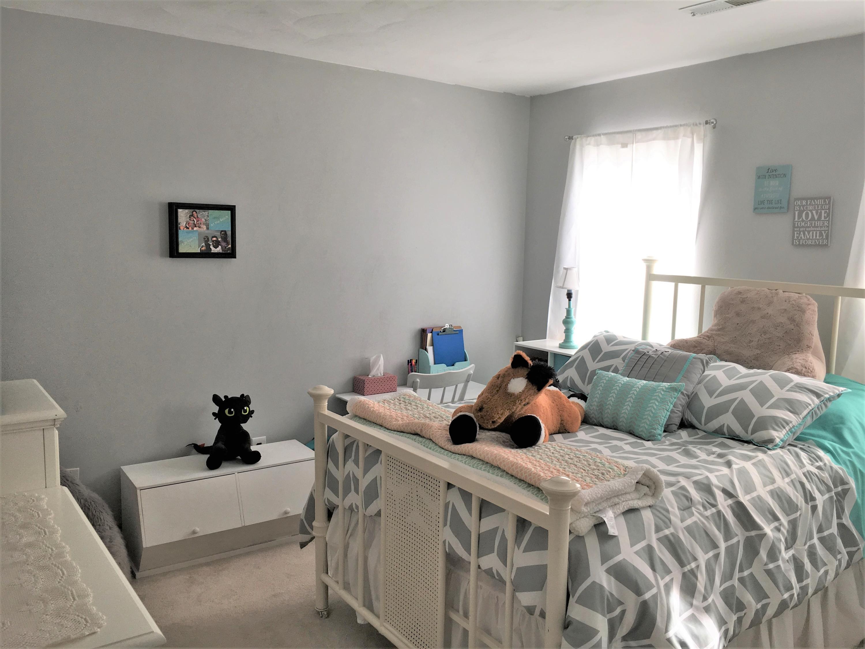 13543 Hardy Road Hardy, VA 24101 - Photo 12 of 24 a bed sitting in a bedroom next to a window with a baby crib