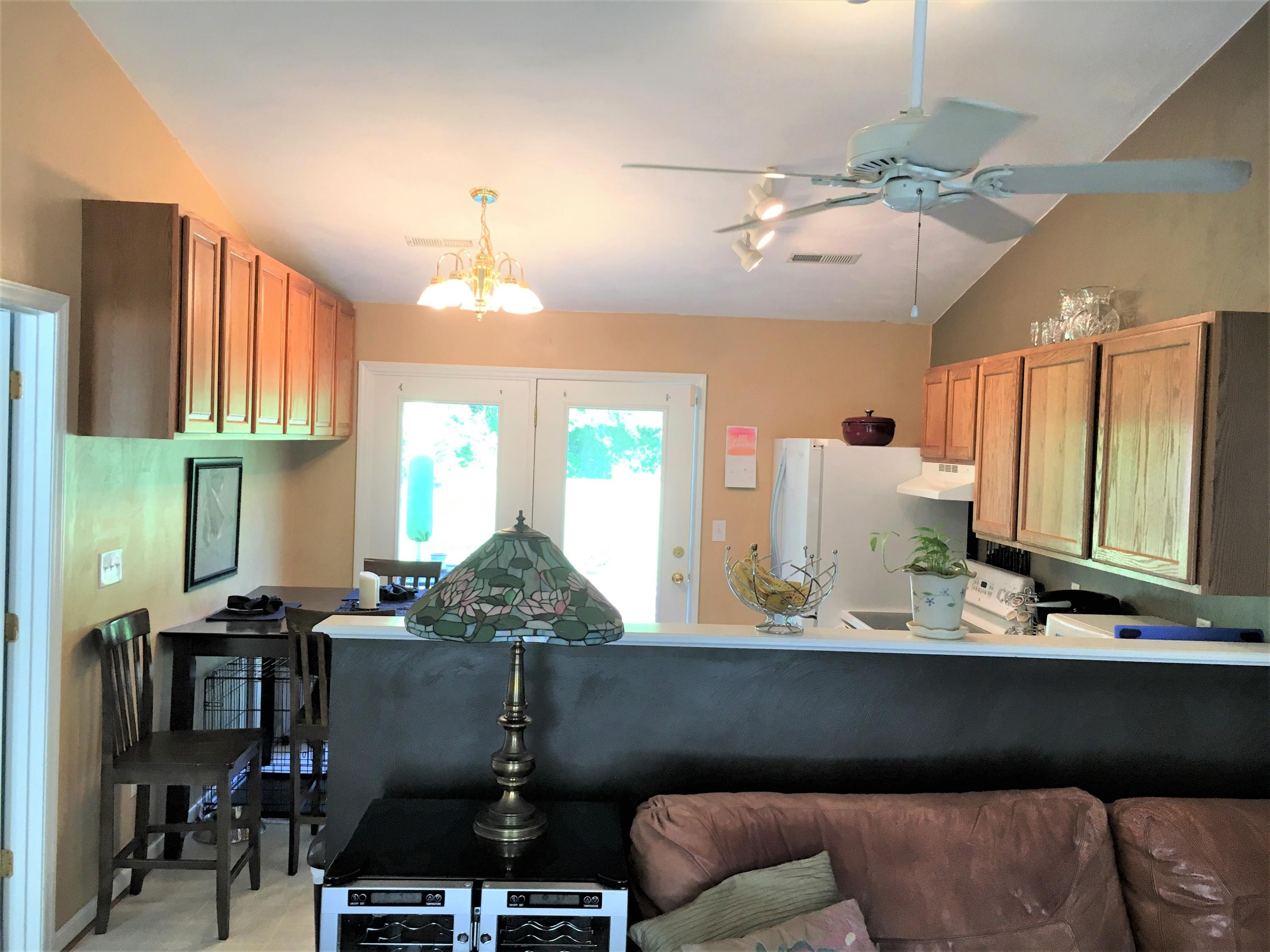 13543 Hardy Road Hardy, VA 24101 - Photo 6 of 24 a kitchen with stainless steel appliances kitchen island granite countertop a table chairs in it and a window