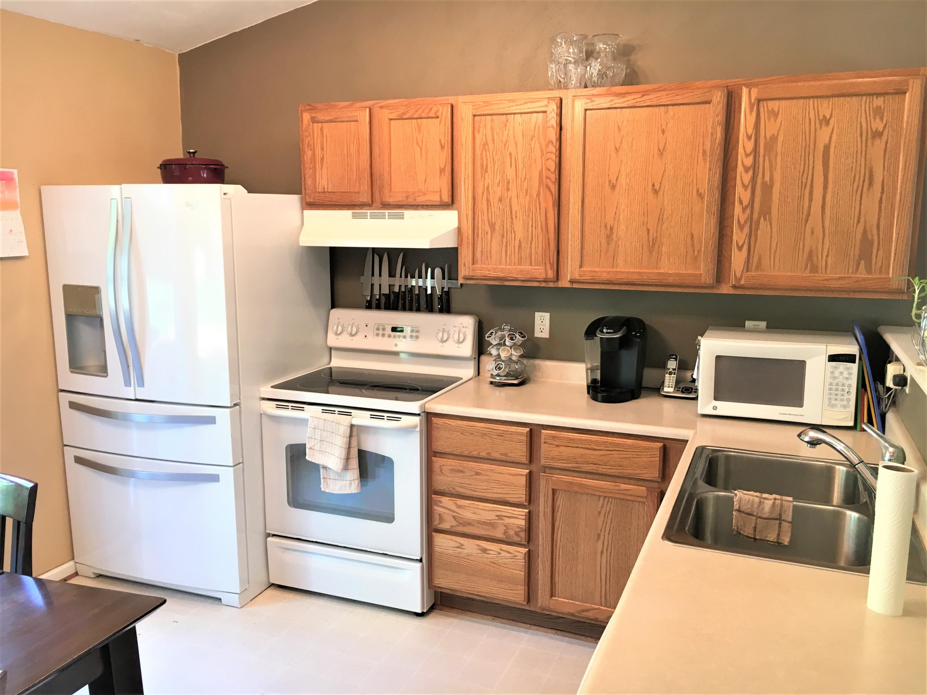 13543 Hardy Road Hardy, VA 24101 - Photo 7 of 24 a kitchen with a refrigerator a stove a sink and cabinets