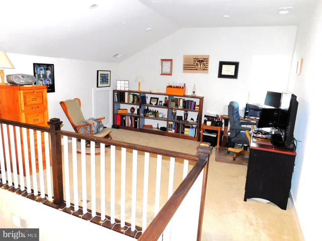 a living room with furniture and flat screen tv