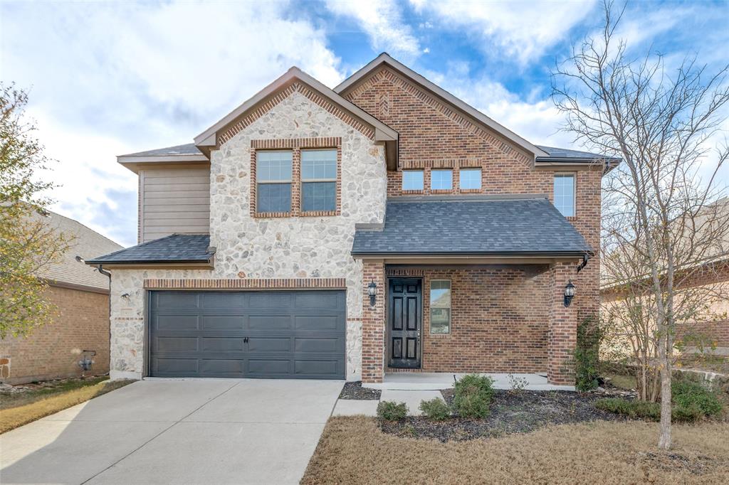 1400 Elizabeth Street Anna, TX 75409 - Photo 1 of 25 a front view of a house with a garage