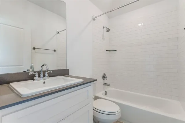 a bathroom with a sink toilet and a bathtub