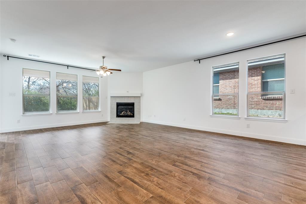 1400 Elizabeth Street Anna, TX 75409 - Photo 5 of 25 a view of an empty room with a window and fireplace