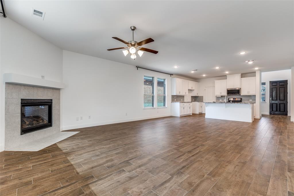 1400 Elizabeth Street Anna, TX 75409 - Photo 7 of 25 a view of an empty room with kitchen and kitchen view