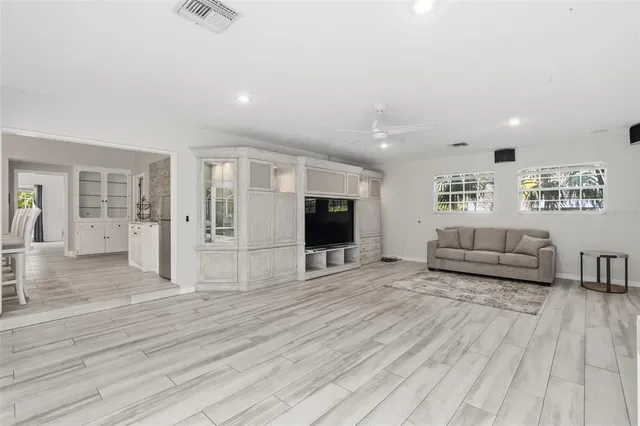a spacious bathroom with a tub double vanity and sink