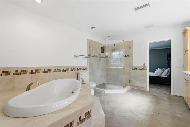 a view of a livingroom with wooden floor and closet area